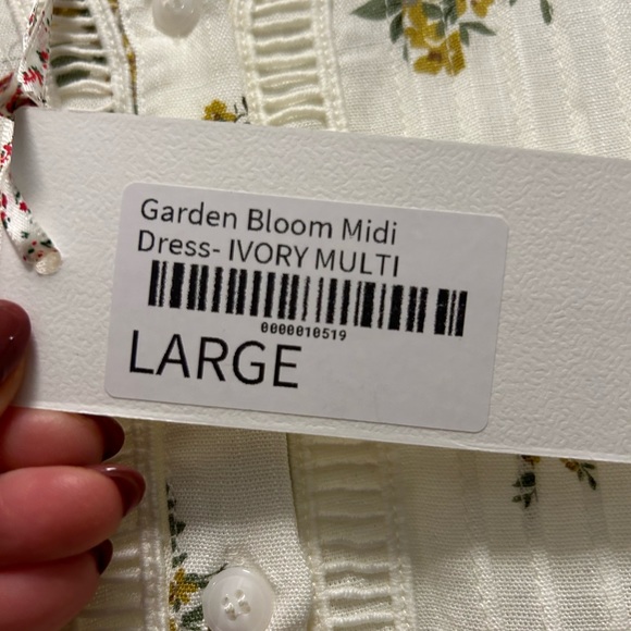 Whimsical, cream w/floral midi dress, 3/4 length sleeve. Lined. Buttons - Picture 2 of 4